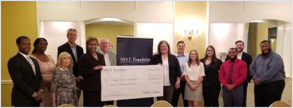 Large check presentation to Carolina Cross Connection from SECU Foundation