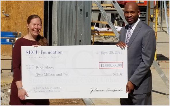 Check presentation for $2 million to Roof Above.